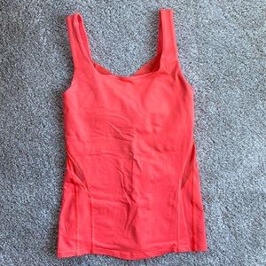 *SOLD* Lululemon salmon workout top with built-in bra, size 4.